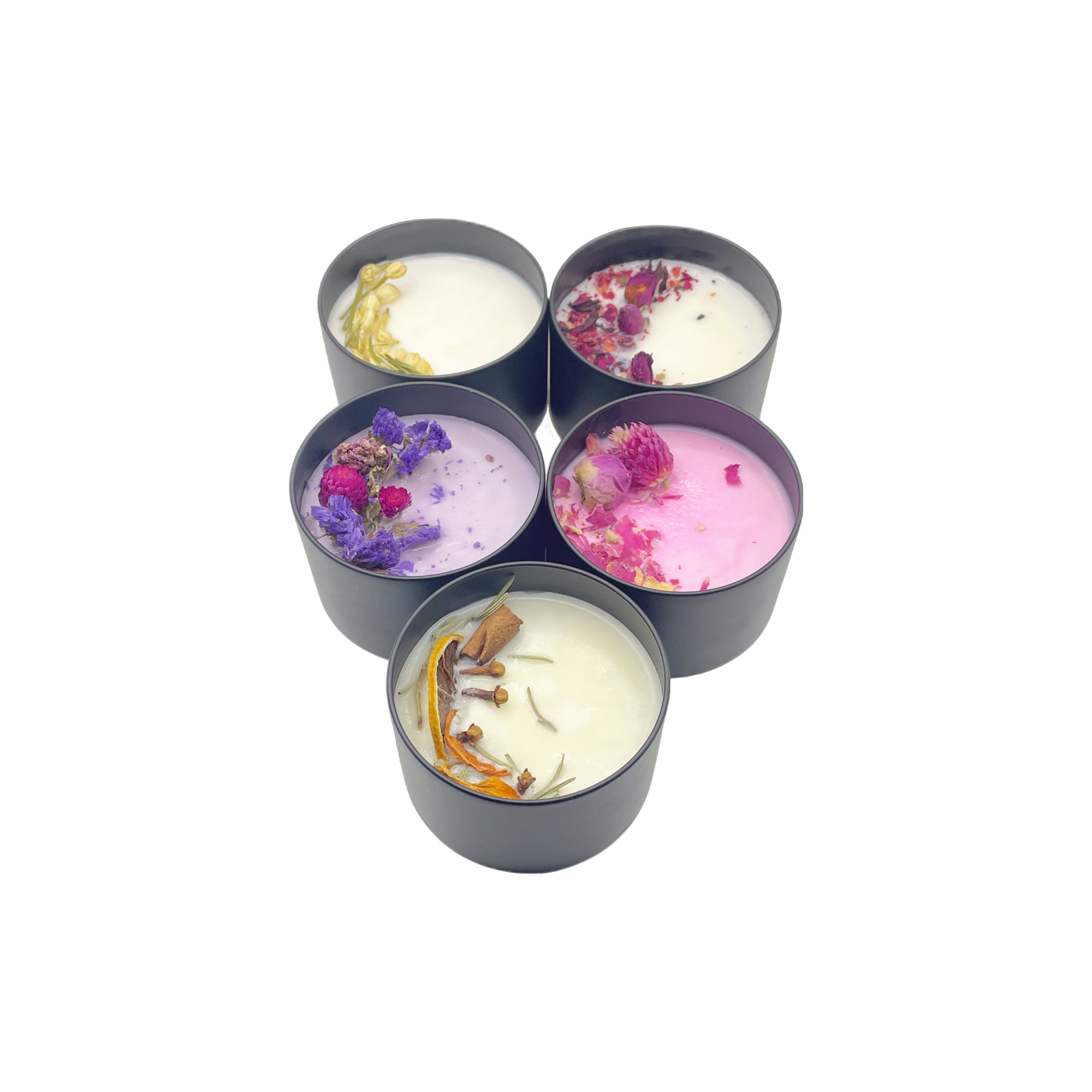 Set of six small candles with floral and decorative elements on a white background