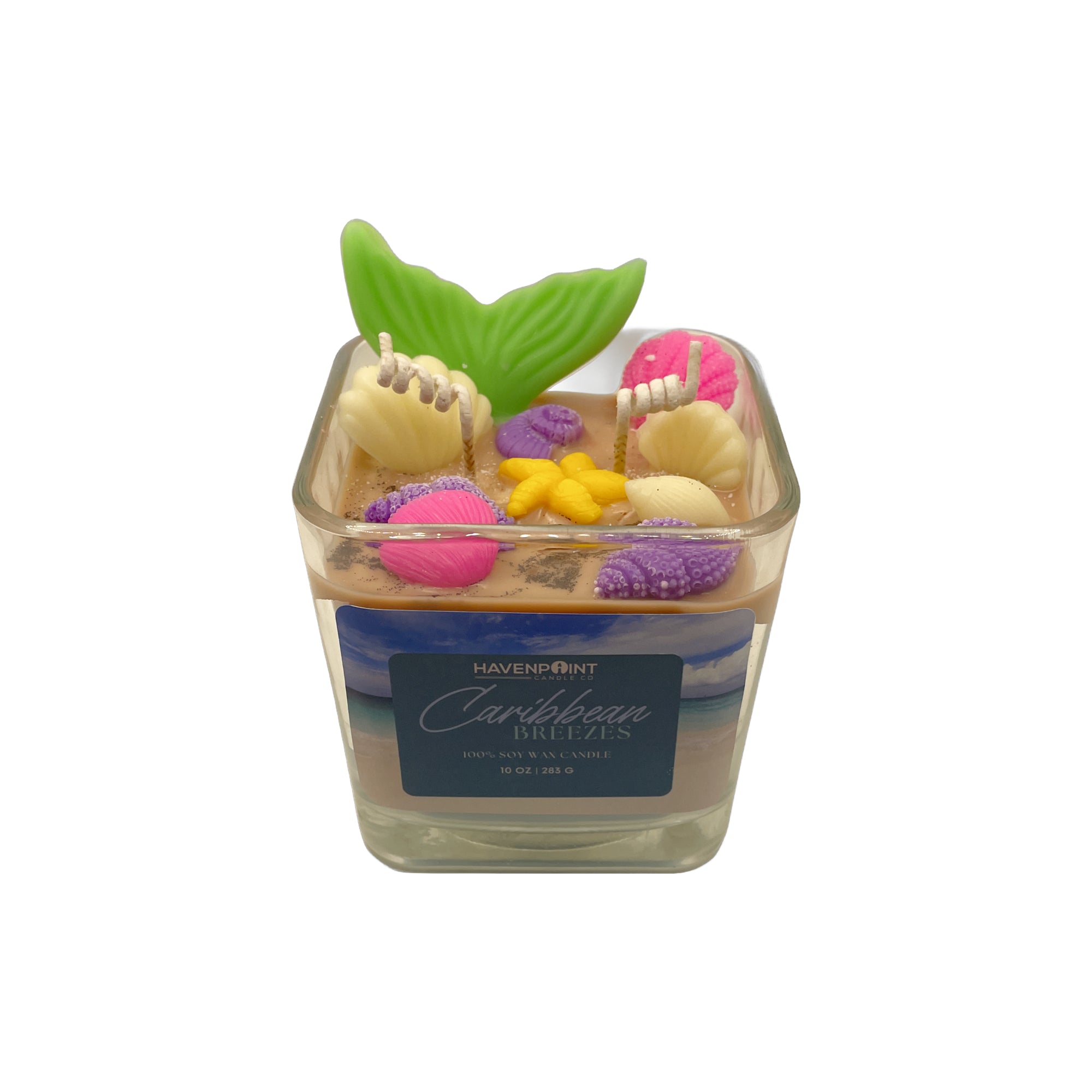 Decorative candle with colorful elements and a leaf on top, branded 'Havenpoint'.
