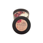 Candle in a tin with floral elements and 'Haven Point' branding on a white background