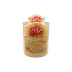 Decorative candle with a sugar cookie design on a white background