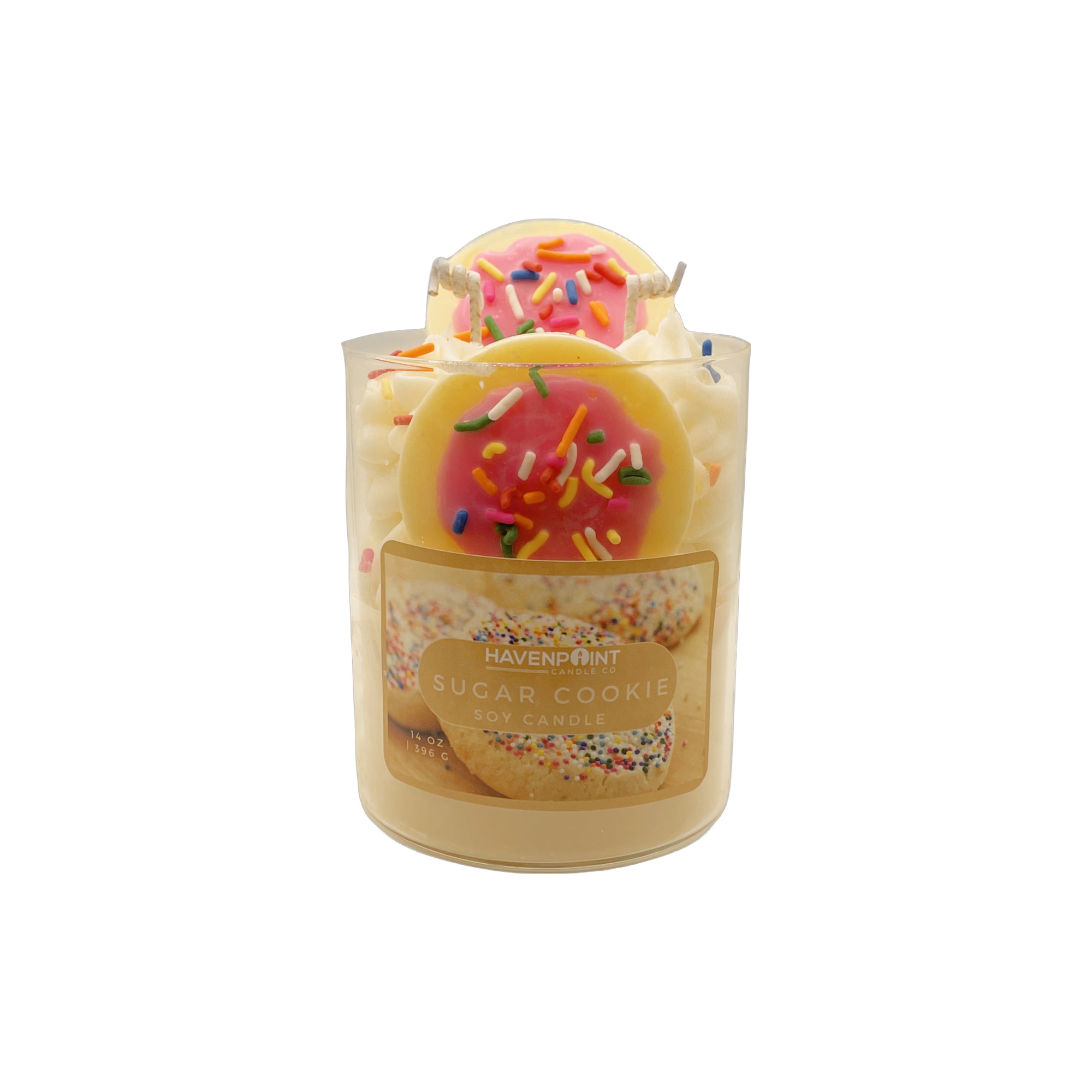 Decorative candle with a sugar cookie design on a white background