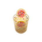 Scented candle with a donut design on a white background